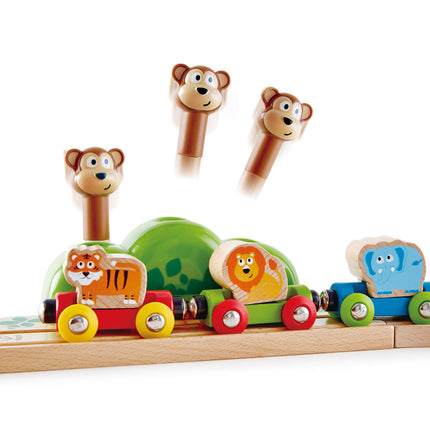 Volg houten treinmuziek en kleine aapjes Hape